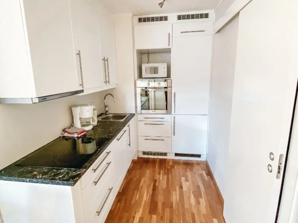 Suite with a kitchen and a balcony